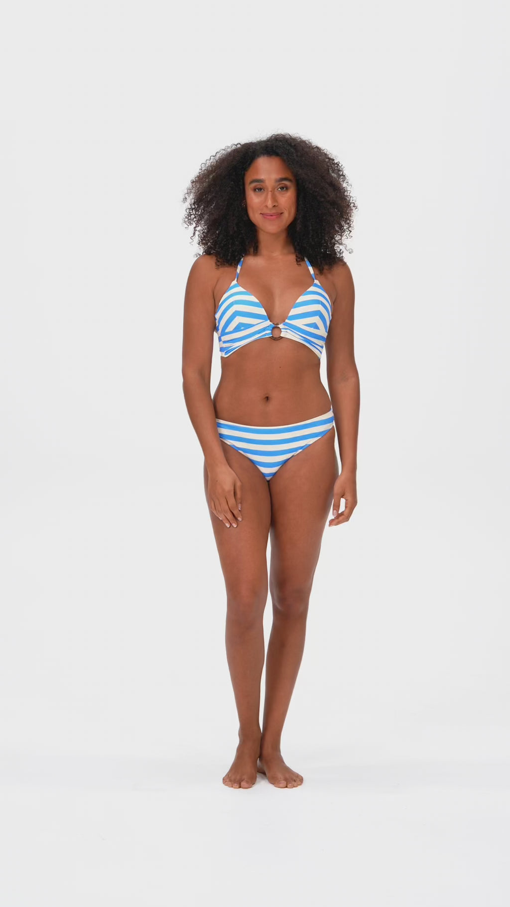 Woman posing in blue stripped bikini