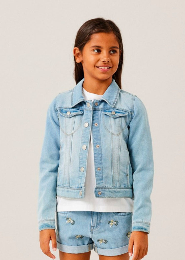 Girl wearing denim jacket